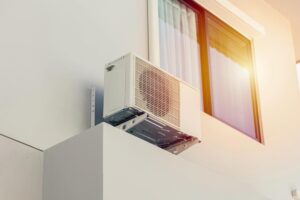 A ductless mini-split system outside the house.